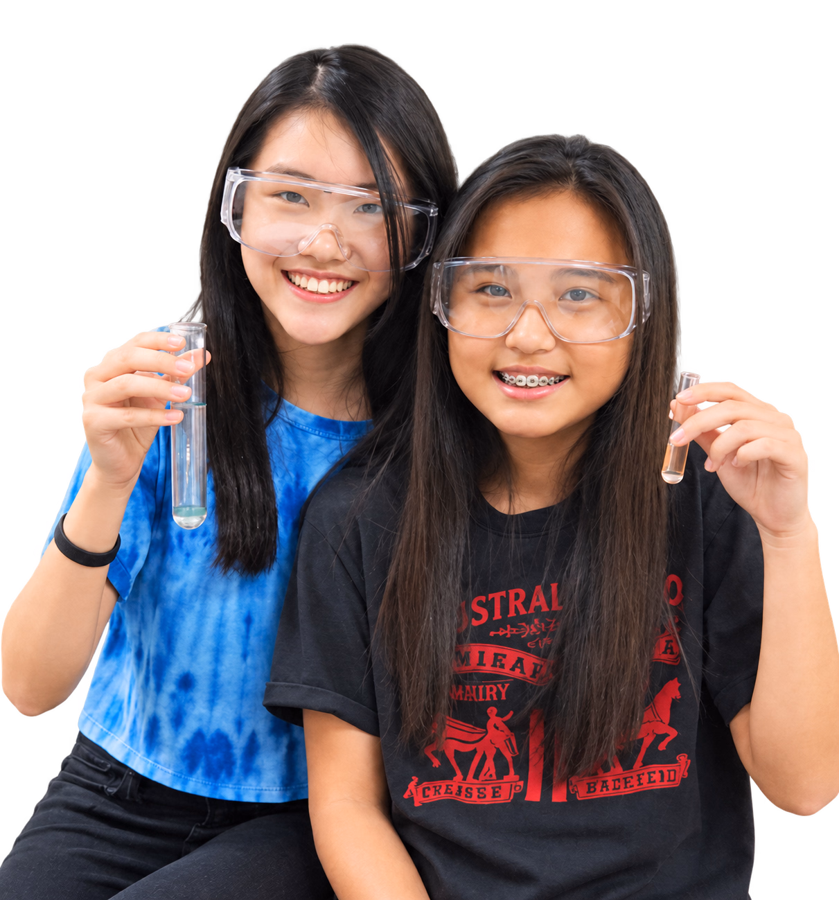 Two students wearing safety goggles and holding test tubes.